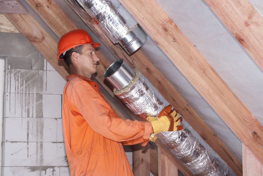 HVAC-technician-working-on-Air-Duct-Replacement-and-Repair