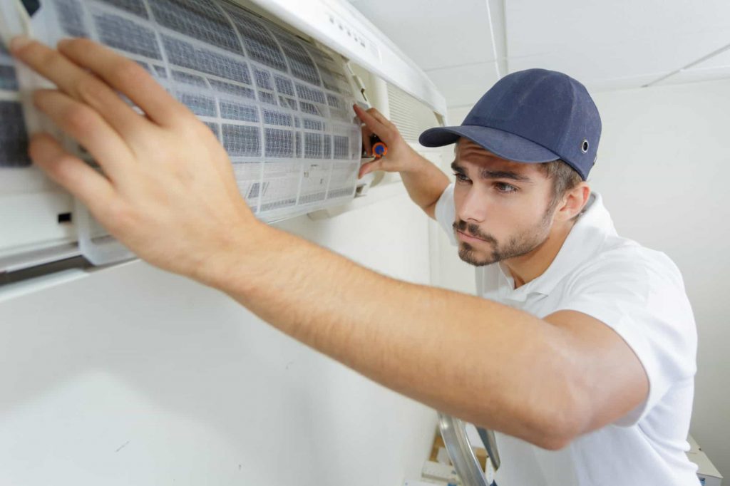 Air Conditioning Technician Installing A Unit