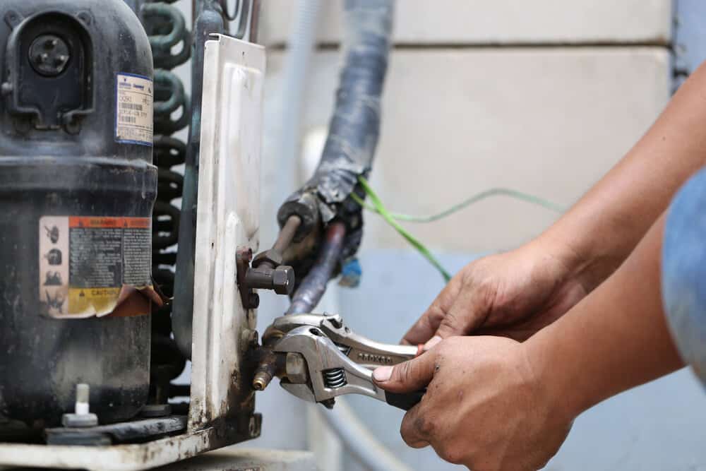 Close up of repairman on the fixing HVAC system