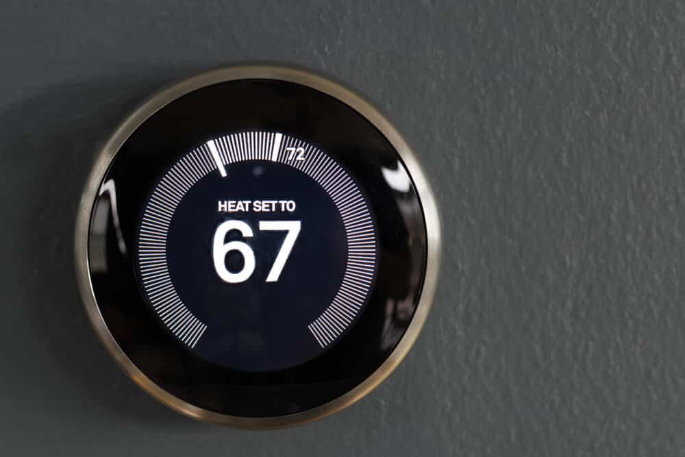 Smart home programmable thermostat from google's nest. Green tech saving heating and cooling costs