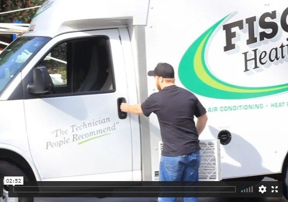 Fischer Heating &Amp; Air Technician Getting Into A Truck
