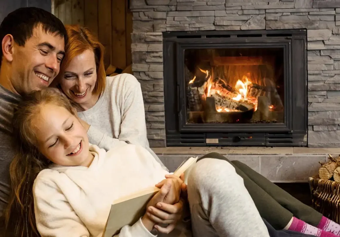 Family Reading By A Fireplace
