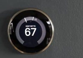 Smart home programmable thermostat from google's nest. Green tech saving heating and cooling costs